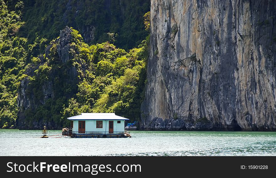 Floating house in a village at Halong Bay in Vietnam