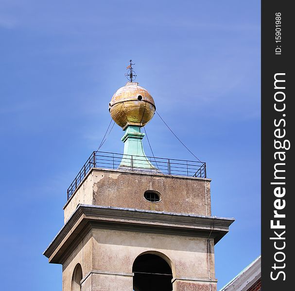 The Golden Ball Monument and weathervain on top of West Wycombe Church Tower in England