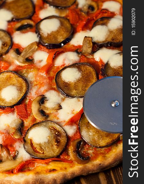 Italian pizza with eggplants, bell peppers and mushrooms. Italian pizza with eggplants, bell peppers and mushrooms