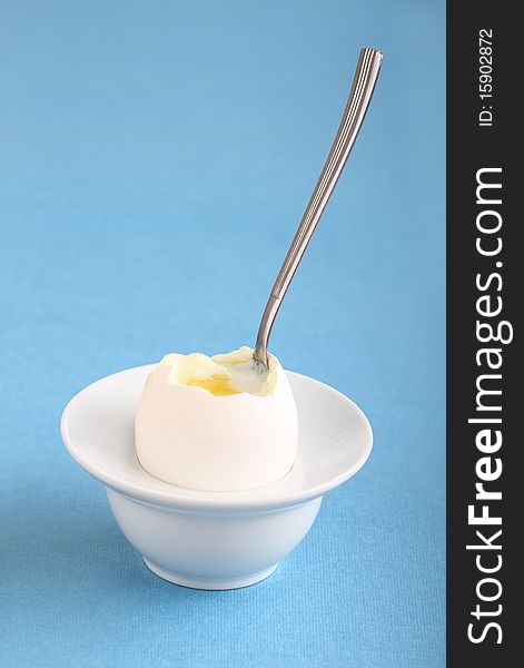 Image of soft boiled egg on a blue background