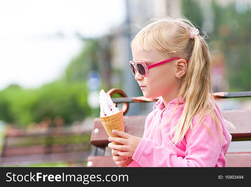 Little Blond Girl Eating Ice-cream