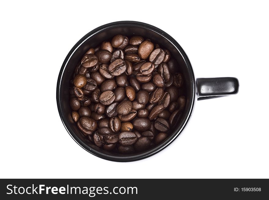 Black coffee cup with coffee grains isolated on white background