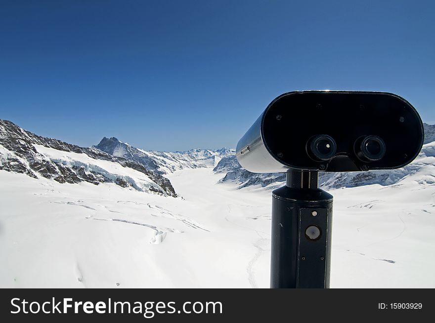 A pair of binoculars and the mountains