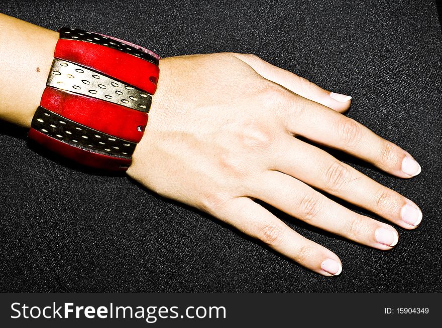 Red oriental bracelet on woman hand