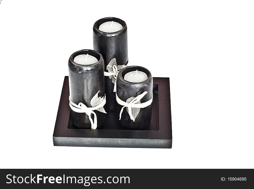 Black candles isolated on white