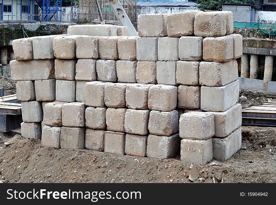 A view of white big stones neat piled on a new home construction site. A view of white big stones neat piled on a new home construction site.