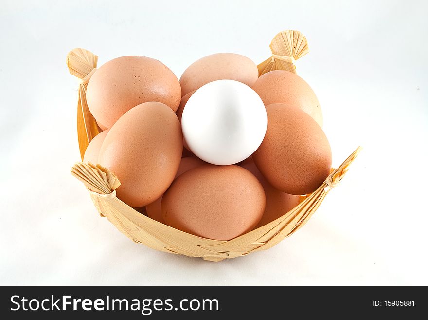 Eggs in a basket isolated on a white background