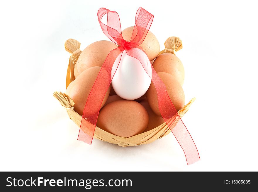 Eggs in a basket and a red bow