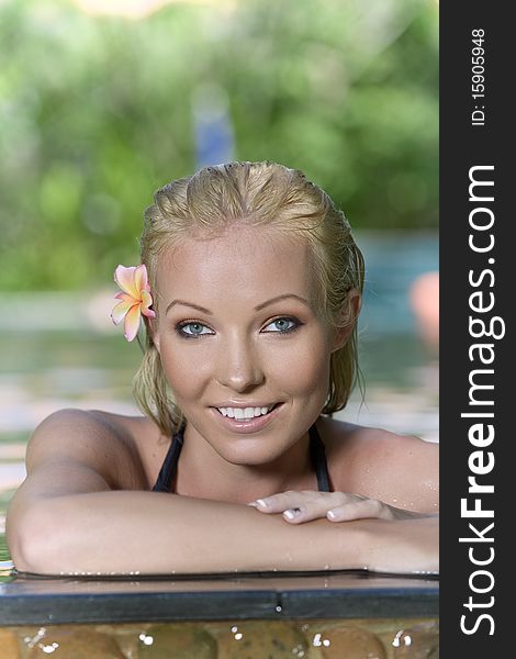 Portrait of young attractive woman having good time swimming pool. Portrait of young attractive woman having good time swimming pool