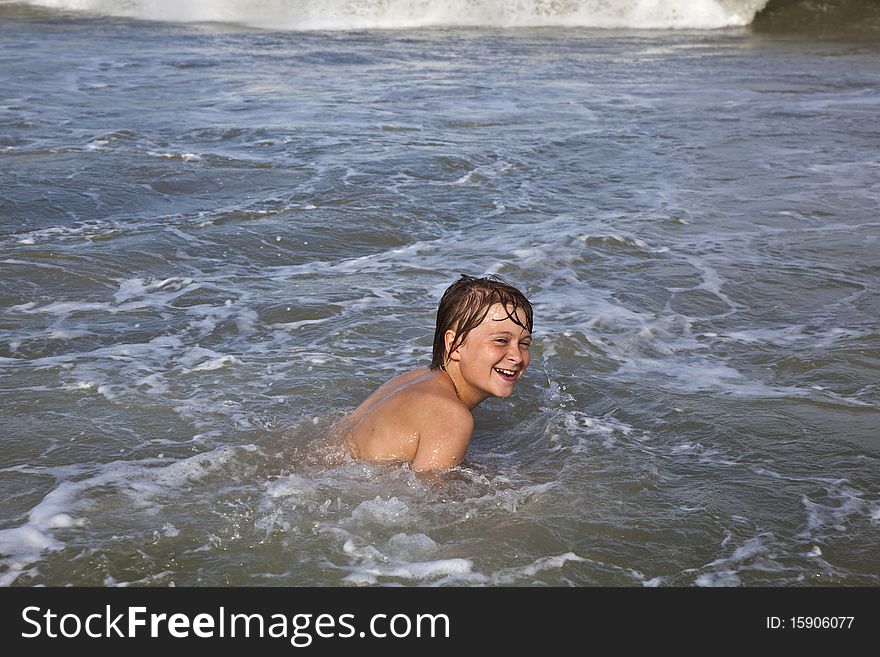 Boy Has Fun In The Ocean