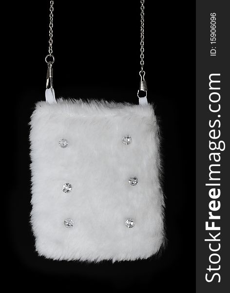 White fur pouch with pastes. Isolated on black background. White fur pouch with pastes. Isolated on black background