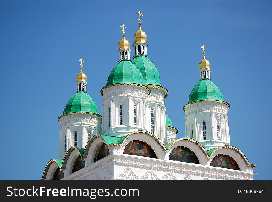 Cupolas of church in Russia with blue sky as background