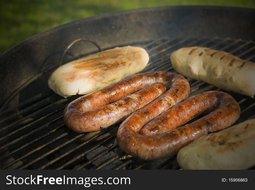 Sausage and bread rolls on the BBQ