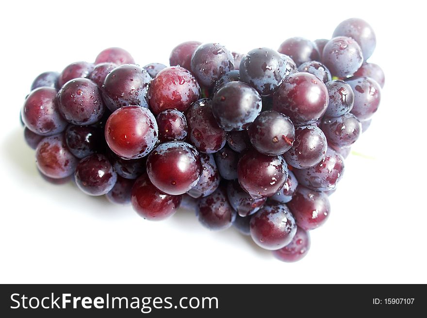 A cluster of grapes isolated on a white background.