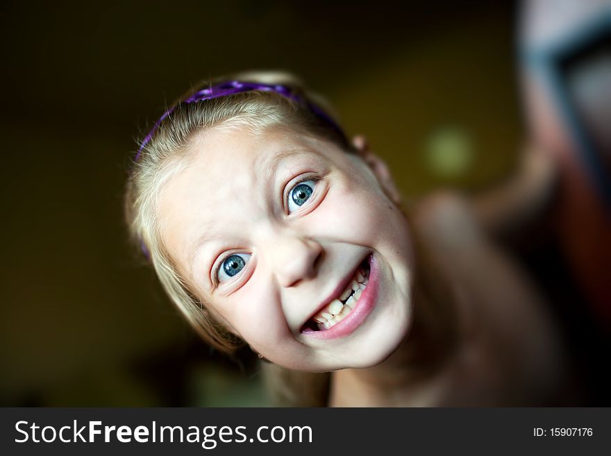 An image of a little girl making funny face. An image of a little girl making funny face