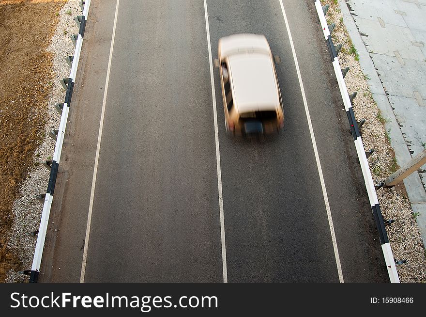 Car in motion on the rural road