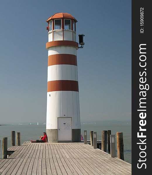 Lighthouse by sunny day on sea