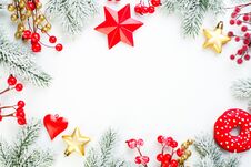 Christmas Background. Xmas Composition Border With Snowy Fir Branch, Red Holly Berries, Gold Stars And Baubles. Stock Photography