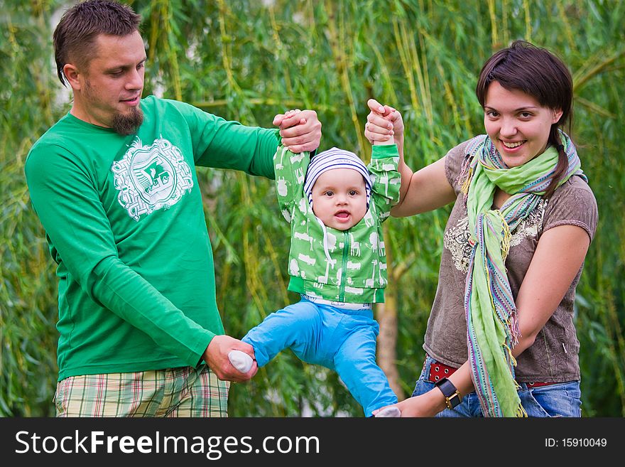 Happy family on a green background