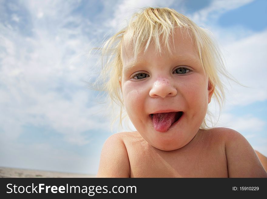 Funny child showing his tongue