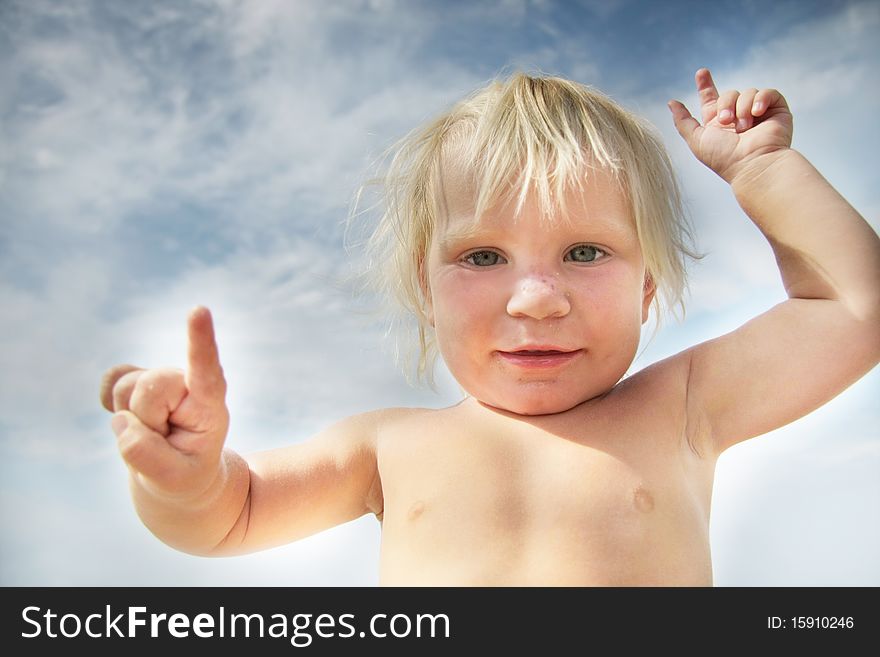 Funny child portrait on sky background