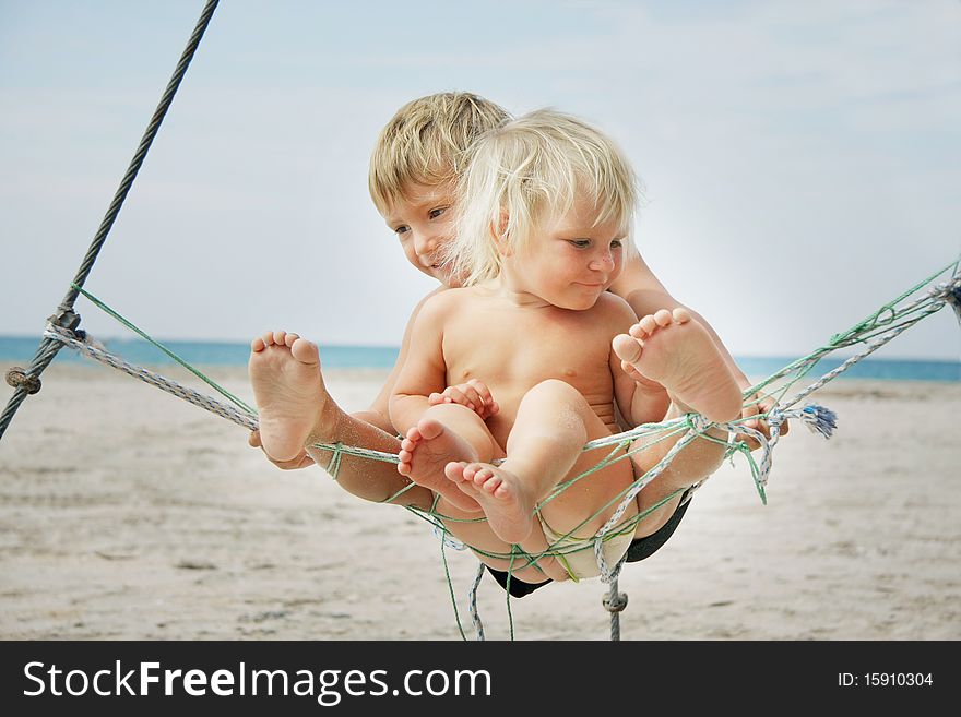 Two kids playing on beach