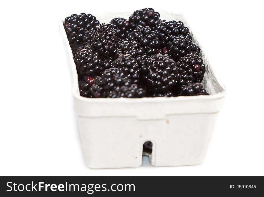Composition of black raspberries on white isolated background in studio