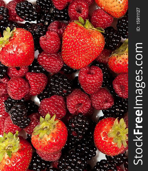 Composition of ripe black and red raspberries and strawberries