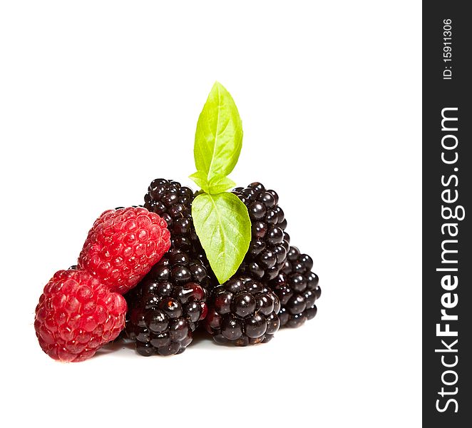 Ripe Black and red raspberries on white isolated background