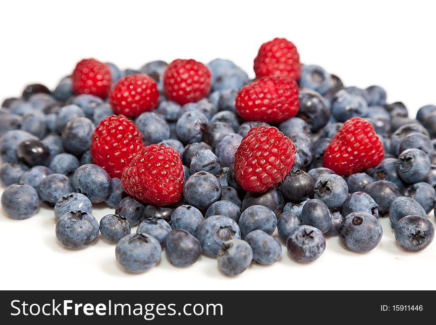 Composition of ripe black and red raspberries, strawberries and blackberries. Composition of ripe black and red raspberries, strawberries and blackberries