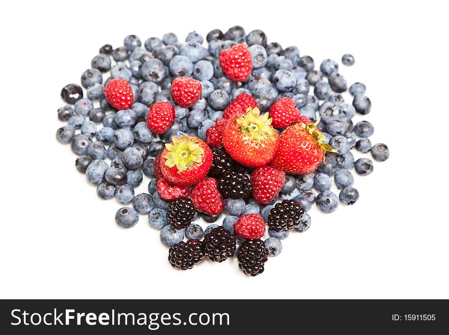 Composition of ripe black and red raspberries, strawberries and blackberries. Composition of ripe black and red raspberries, strawberries and blackberries