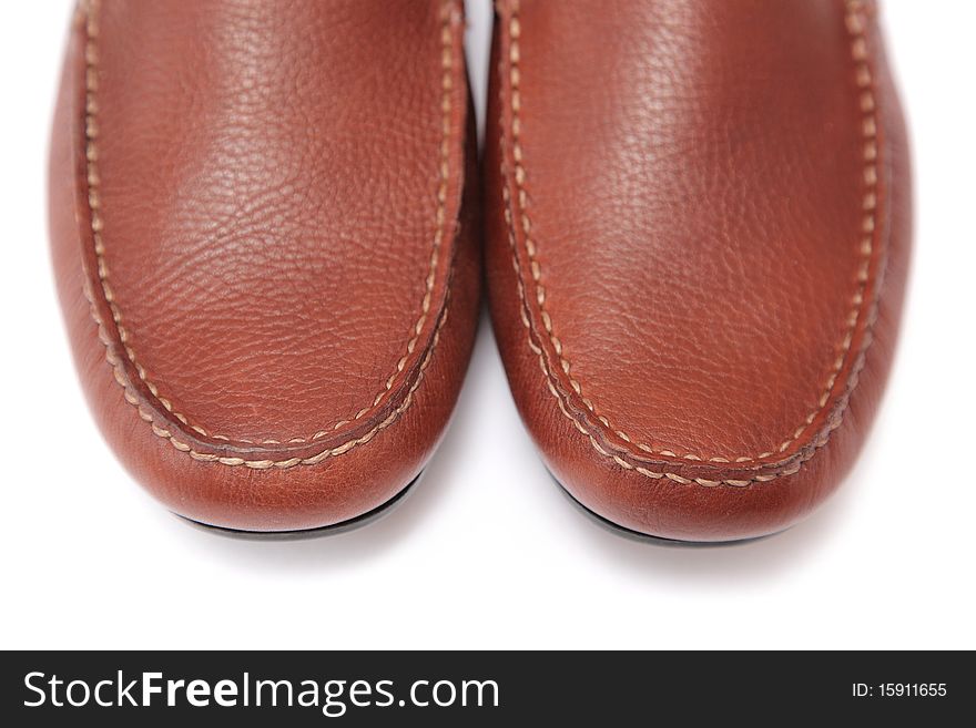Brown leather shoes studio close-up shot on white background