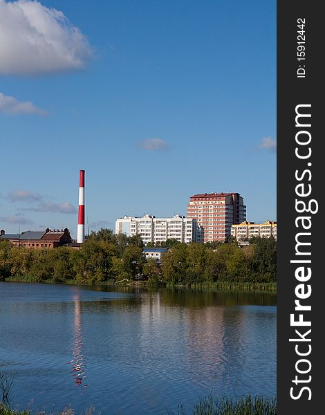 Russia, provincial city, buildings and boiler-house on riverside