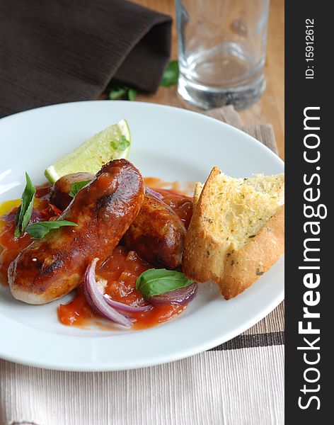 Sausage casserole with garlic bread