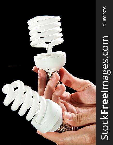 Energy Saving Light Bulbs In Hand