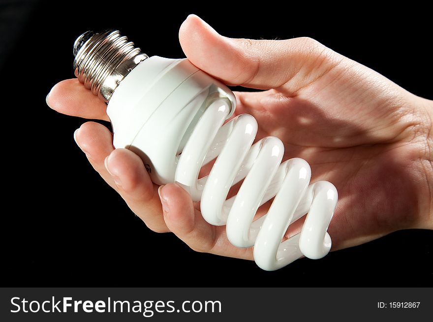 Energy saving light bulb in woman hand. Energy saving light bulb in woman hand