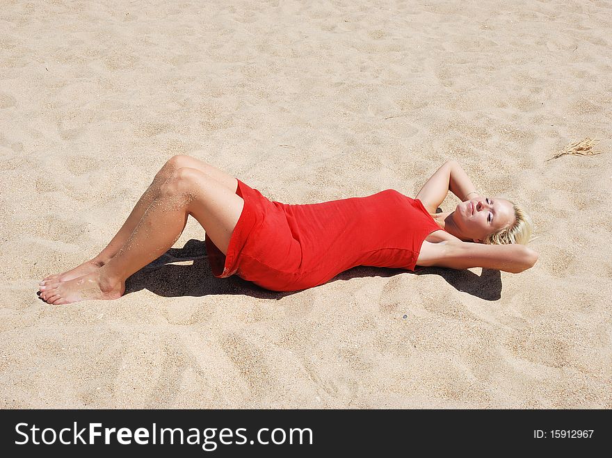 Woman in red dress at beach. Woman in red dress at beach