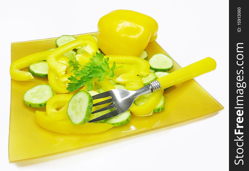 Vegetable salad with yellow pepper cucumber ready to eat with fork. Vegetable salad with yellow pepper cucumber ready to eat with fork