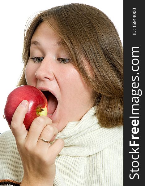 Portrait of woman eating apple over white