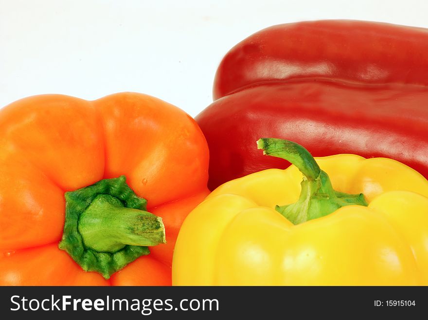 Colorful close-up background of red yellow and orange bell peppers. Colorful close-up background of red yellow and orange bell peppers