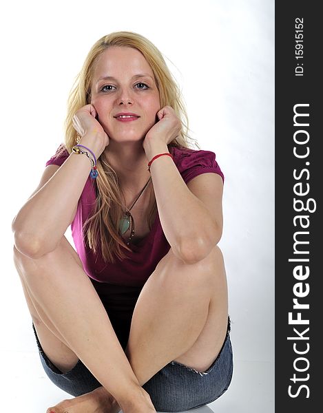 Attractive young blond girl sitting