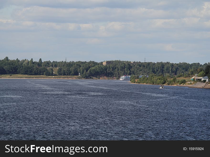 Ship sailing along the Volga river near the town of Uglich