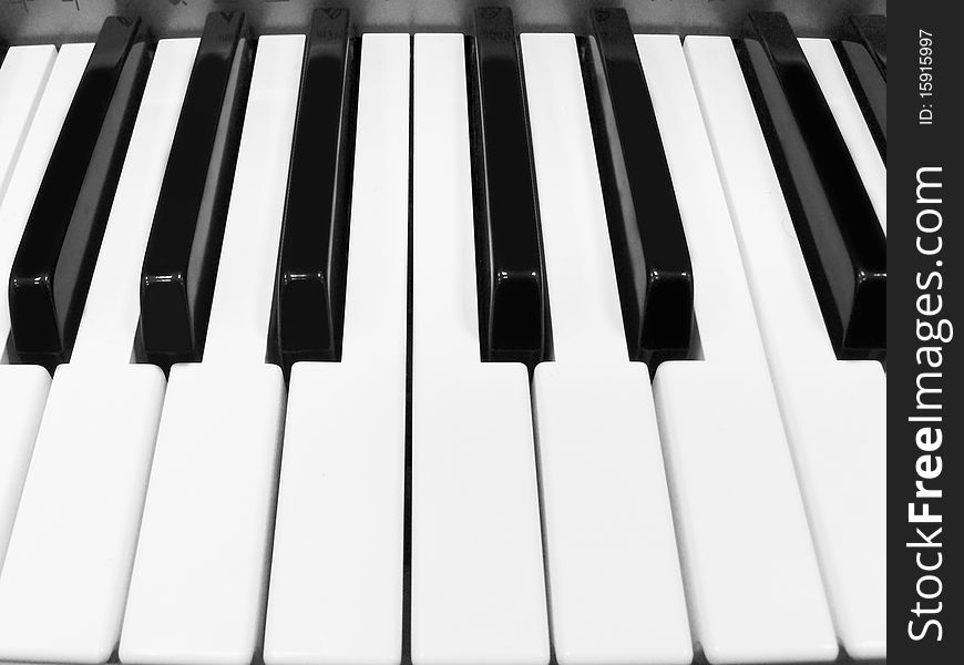 The image of piano keyboard with white and black keys