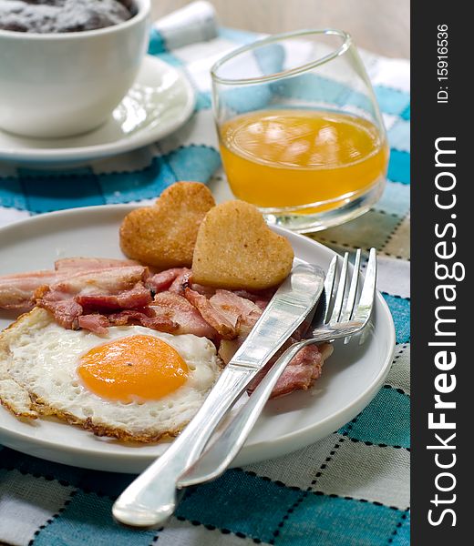 Bacon, Eggs, Toast, Orange Juice and Coffee for breakfast