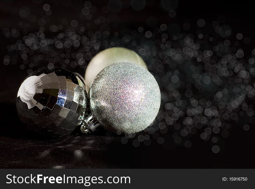 Silver christmas balls on black background. Silver christmas balls on black background