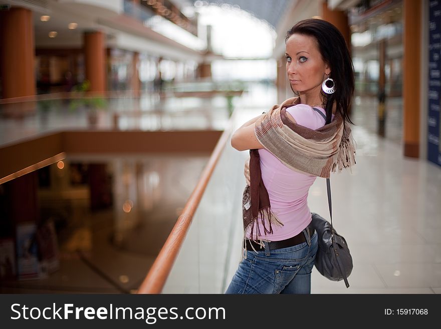 Portrait of a girl wearing a scarf over mall background. Portrait of a girl wearing a scarf over mall background