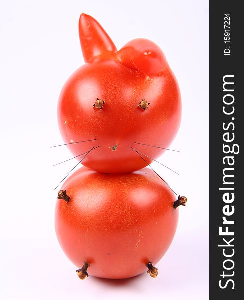 Rabbit made of tomatoes with eyes and legs made of dried cloves. Rabbit made of tomatoes with eyes and legs made of dried cloves