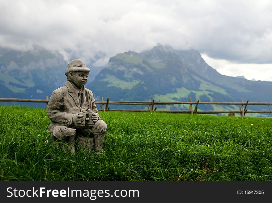 Sculpture gamekeeper over Appenzell in Swiss Alps. Sculpture gamekeeper over Appenzell in Swiss Alps