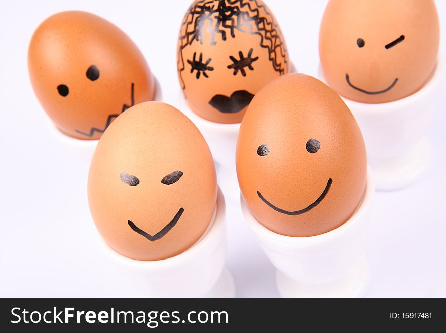 Eggs with smiling faces on white background. Eggs with smiling faces on white background