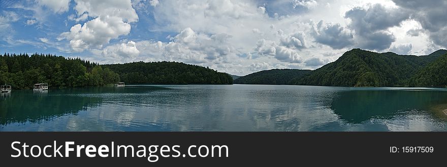 Panorama of a landscape consisting of mountains and lake